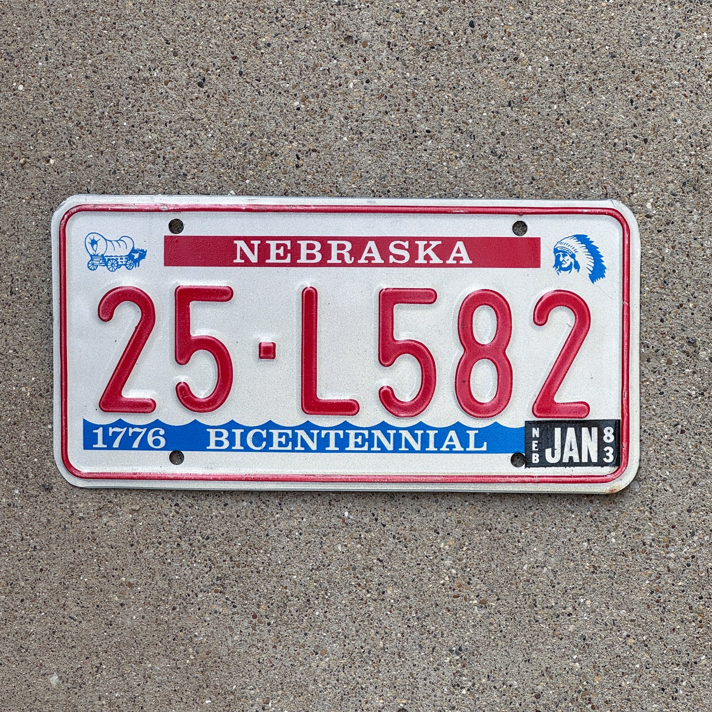 Photo of a 1976 1983 Nebraska License Plate Auto Tag Garage Decor Vintage Bicentennial 25 L582 with original patina