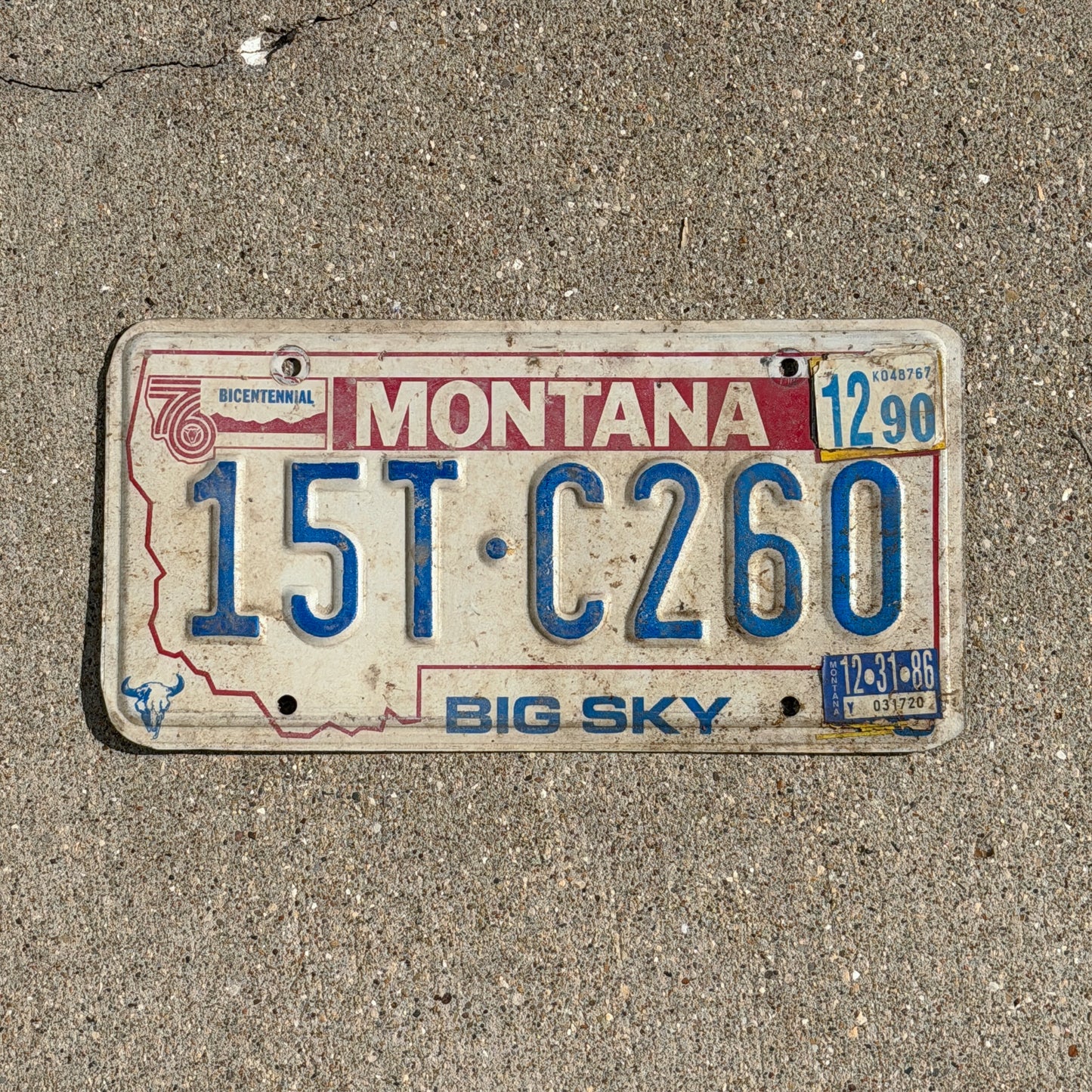 Photo of a 1976 1990 Montana Truck License Plate Auto Tag Garage Decor Vintage Bicentennial 15 TC 260 with original patina