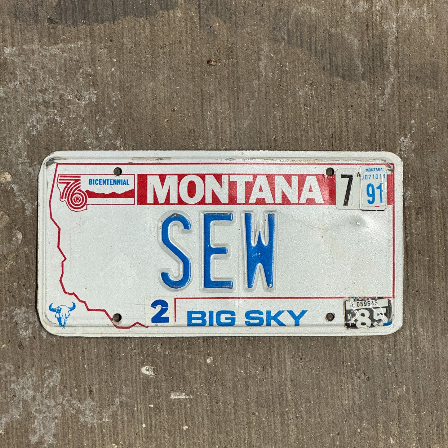 Photo of a 1976 1991 Montana Vanity License Plate Auto Tag Garage Decor Vintage Sewing Room Decor SEW with original patina