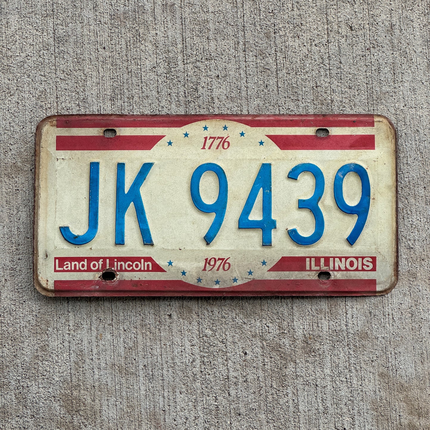 Photo of a 1976 Illinois License Plate Auto Tag 2 Vintage Garage Bicentennial JK 9439 with original patina