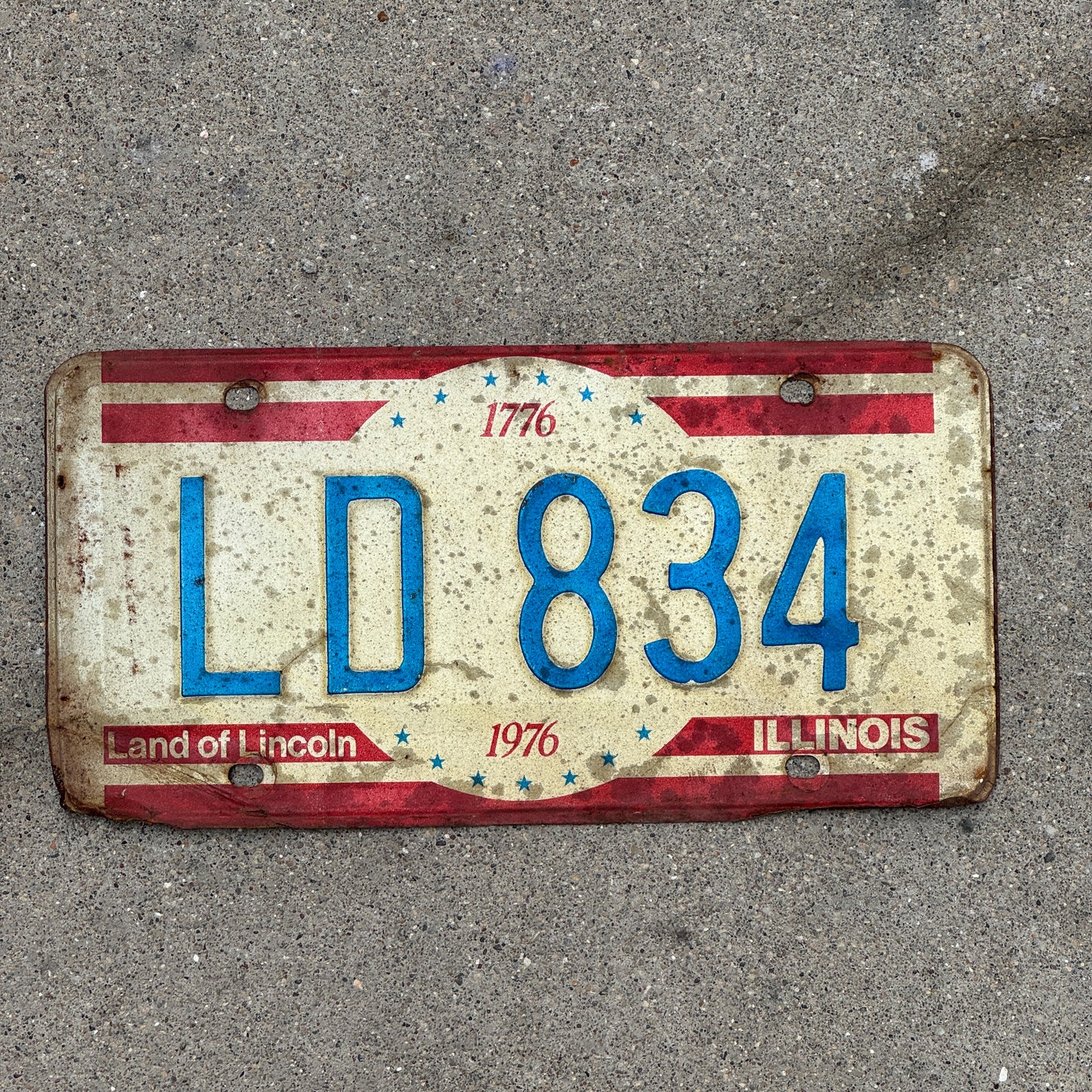Photo of a 1976 Illinois License Plate Auto Tag 2 Vintage Garage Bicentennial LD 834 with original patina