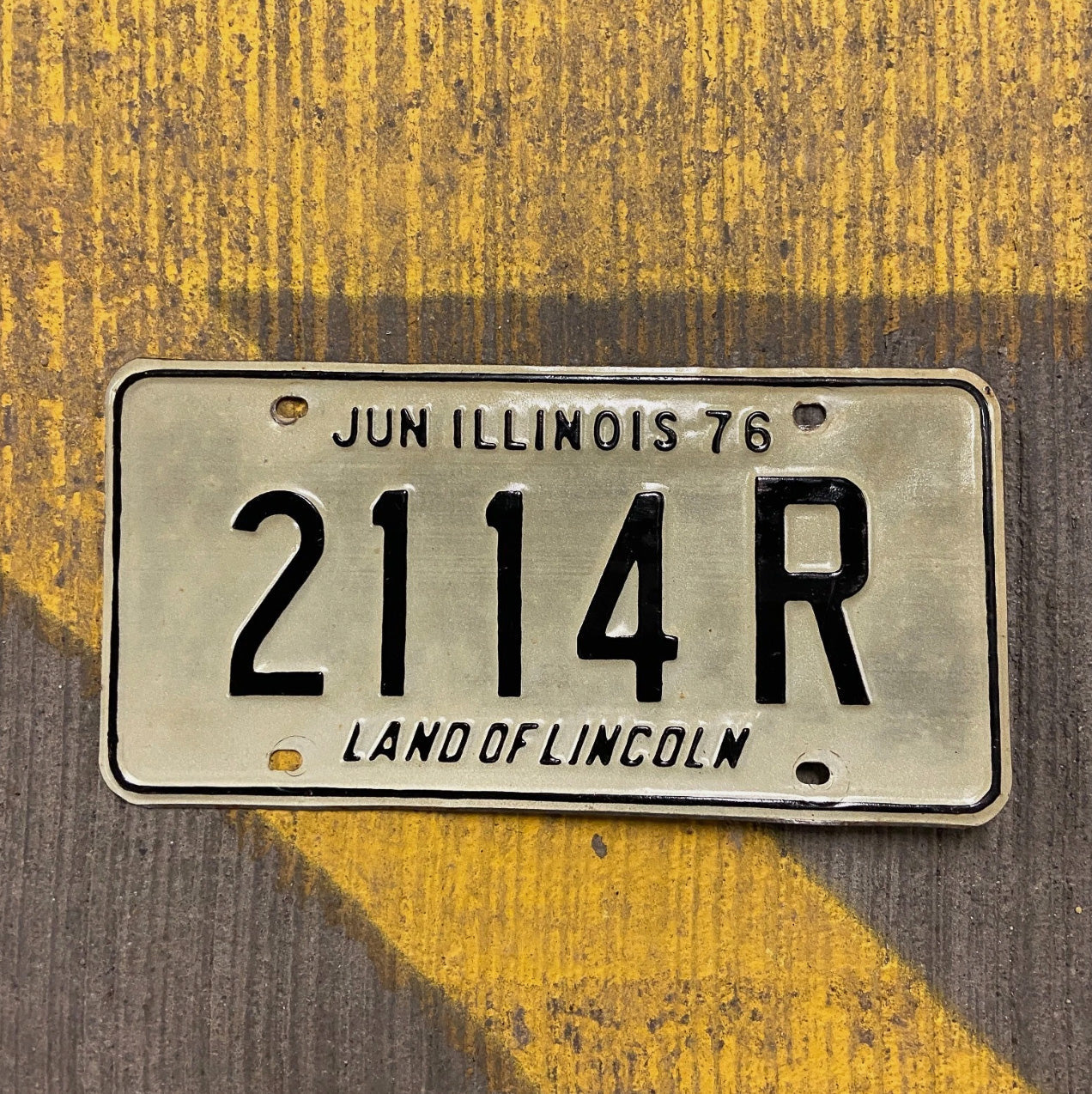 Photo of a 1976 Illinois Truck License Plate Auto Tag Garage Decor Vintage 2114 R with original patina