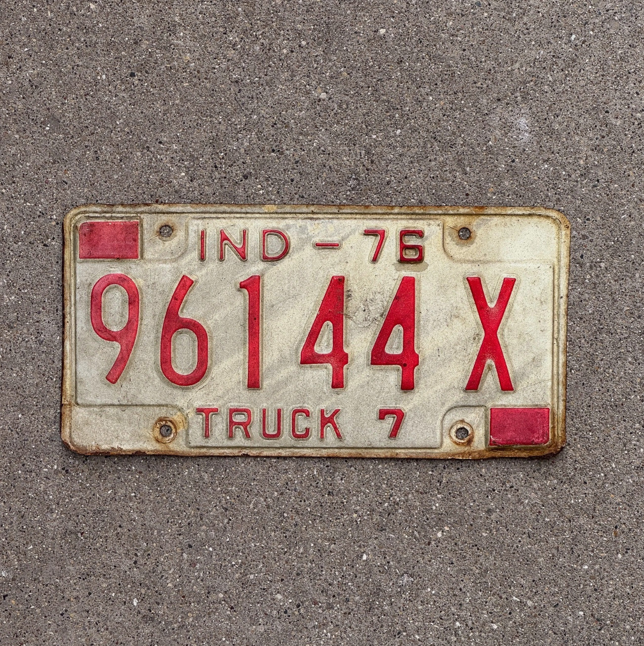 Photo of a 1976 Indiana Truck License Plate Auto Tag Garage Decor 96144 X