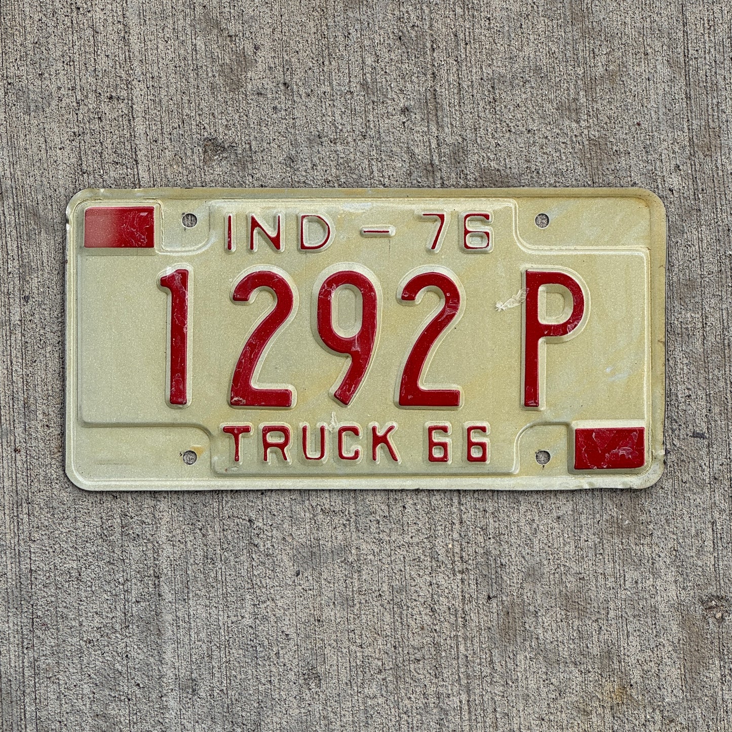 Photo of a 1976 Indiana Truck License Plate Auto Tag Garage Decor Vintage 1292 P with original patina
