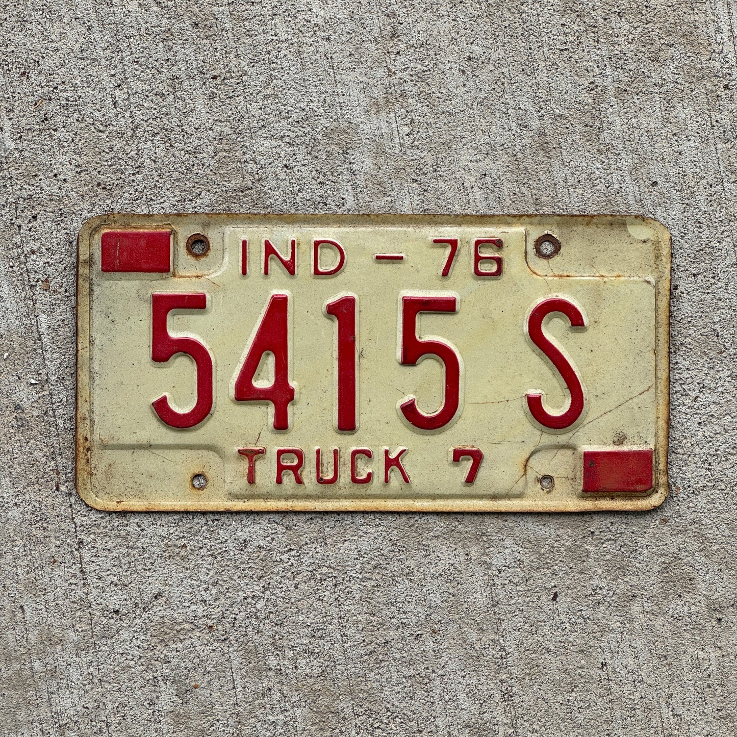 Photo of a 1976 Indiana Truck License Plate Auto Tag Garage Decor Vintage 5415 S with original patina