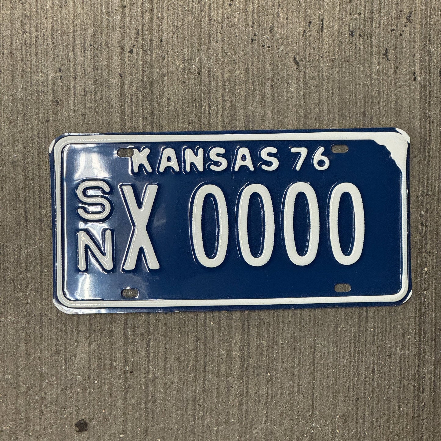 Photo of a 1976 Kansas SAMPLE License Plate Auto Tag Garage Decor Vintage SN X 0000