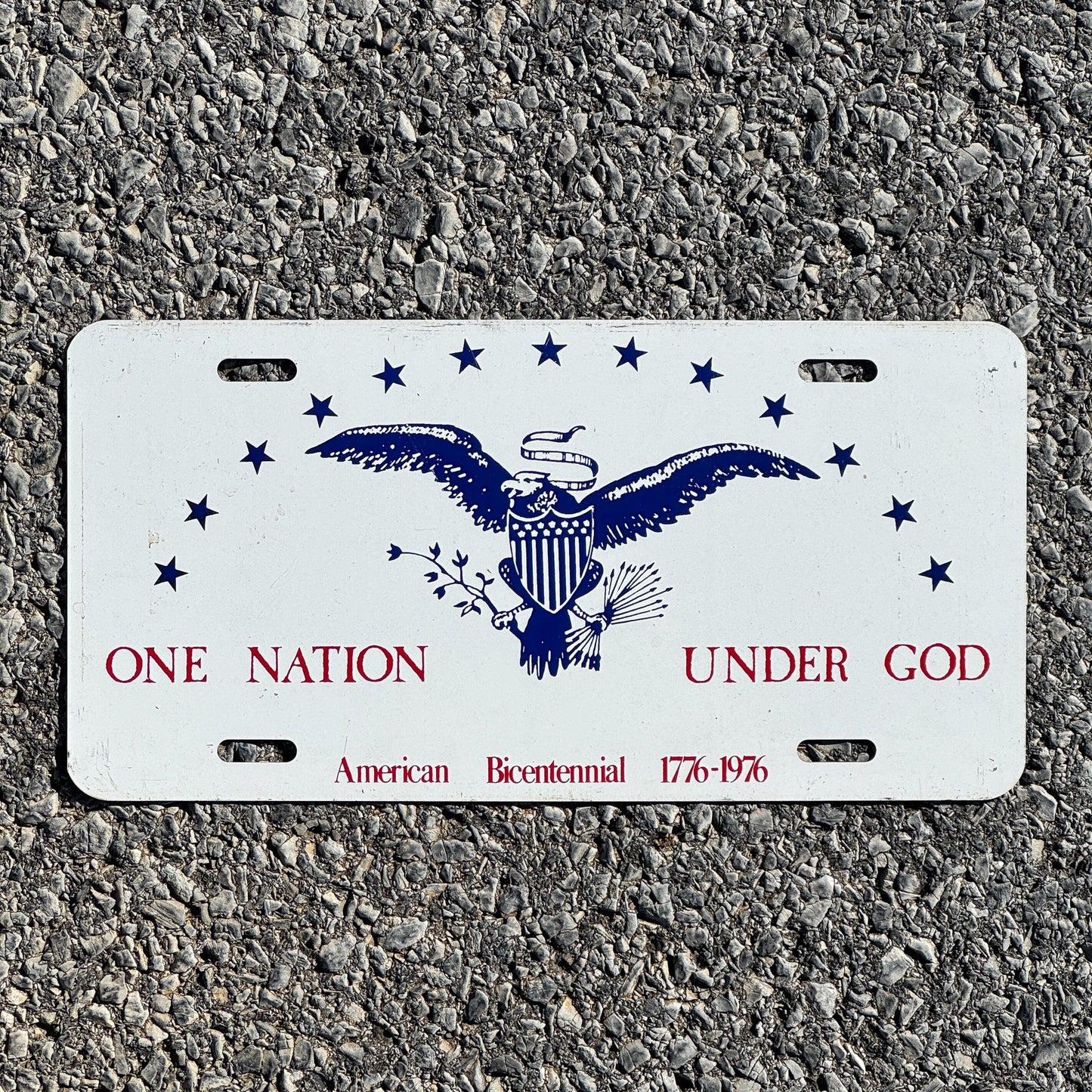 Photo of a 1976 License Plate Auto Tag Garage Decor Vintage One Nation Under God