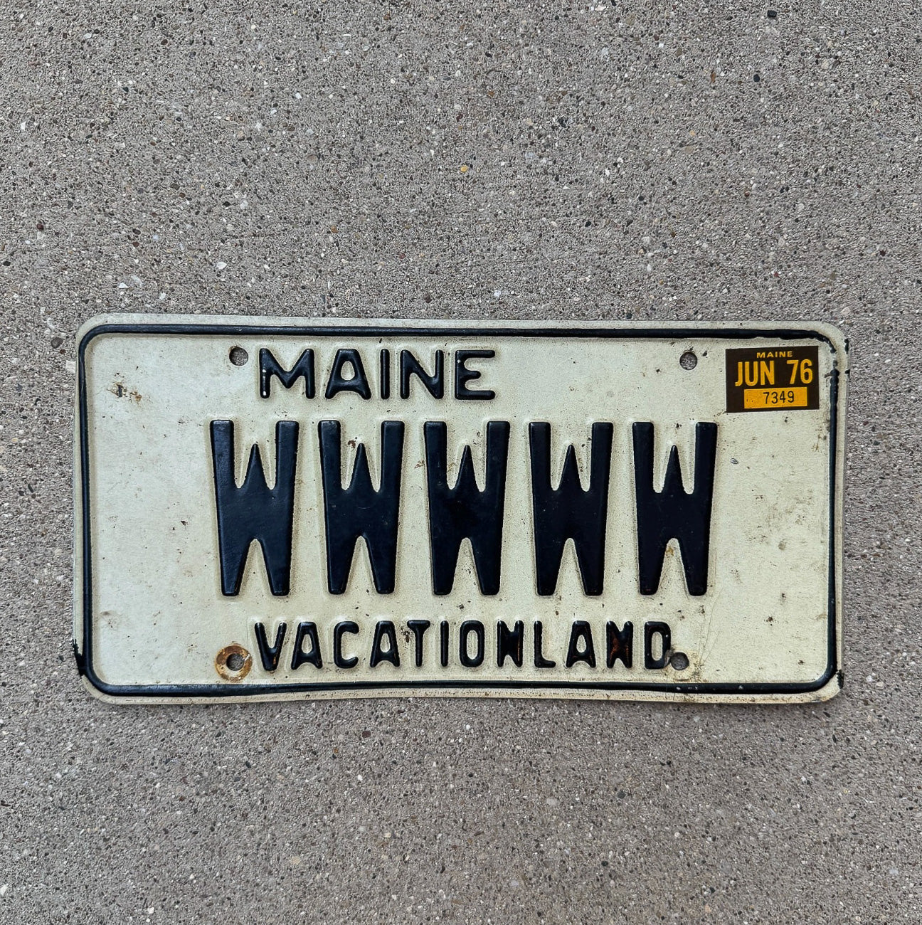 Photo of a 1976 Maine Vanity License Plate Auto Tag Garage Decor Vintage Repeat Repeating WWWWW with original patina