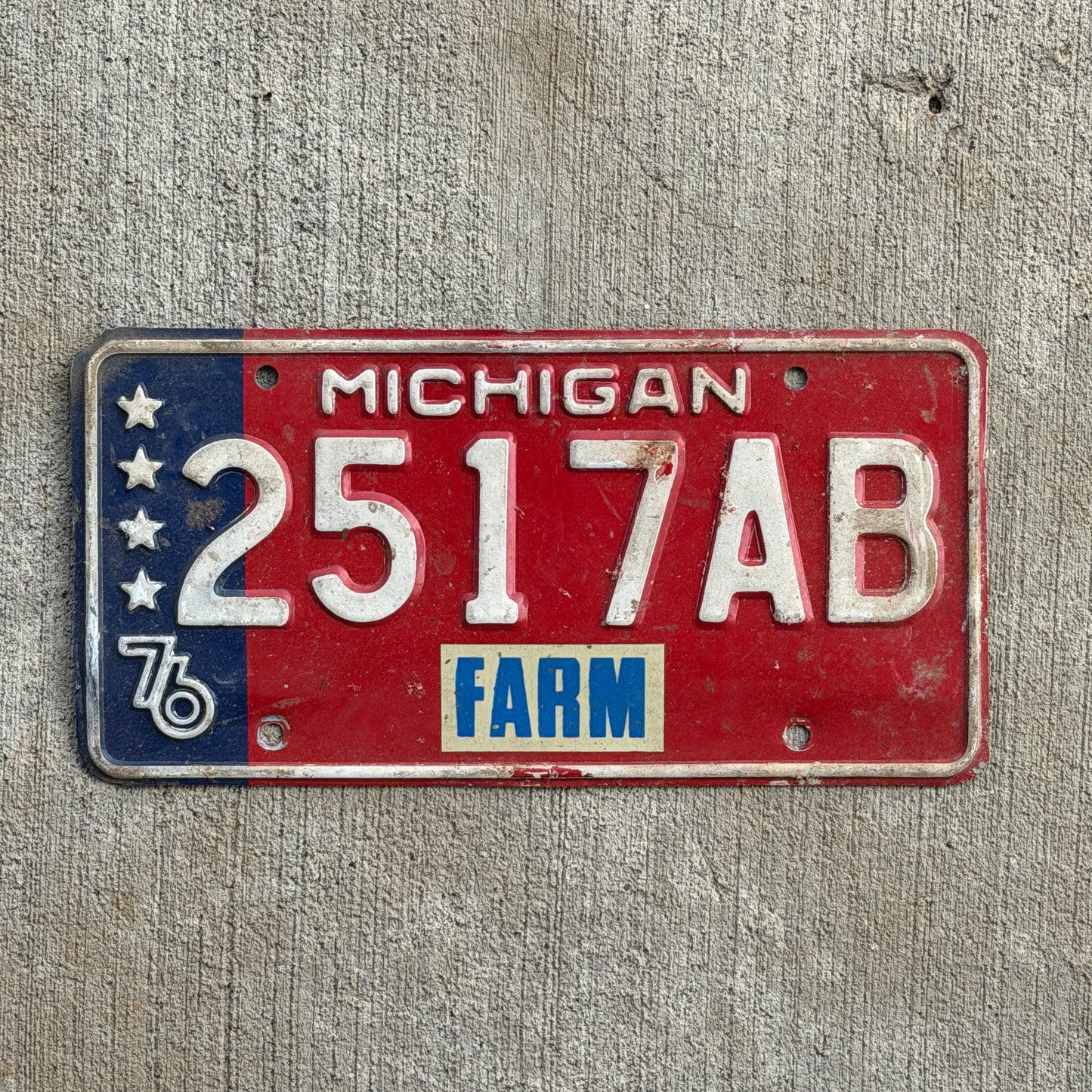 Photo of a 1976 Michigan Farm License Plate Auto Tag Garage Decor Vintage Bicentennial 2517 AB with original patina