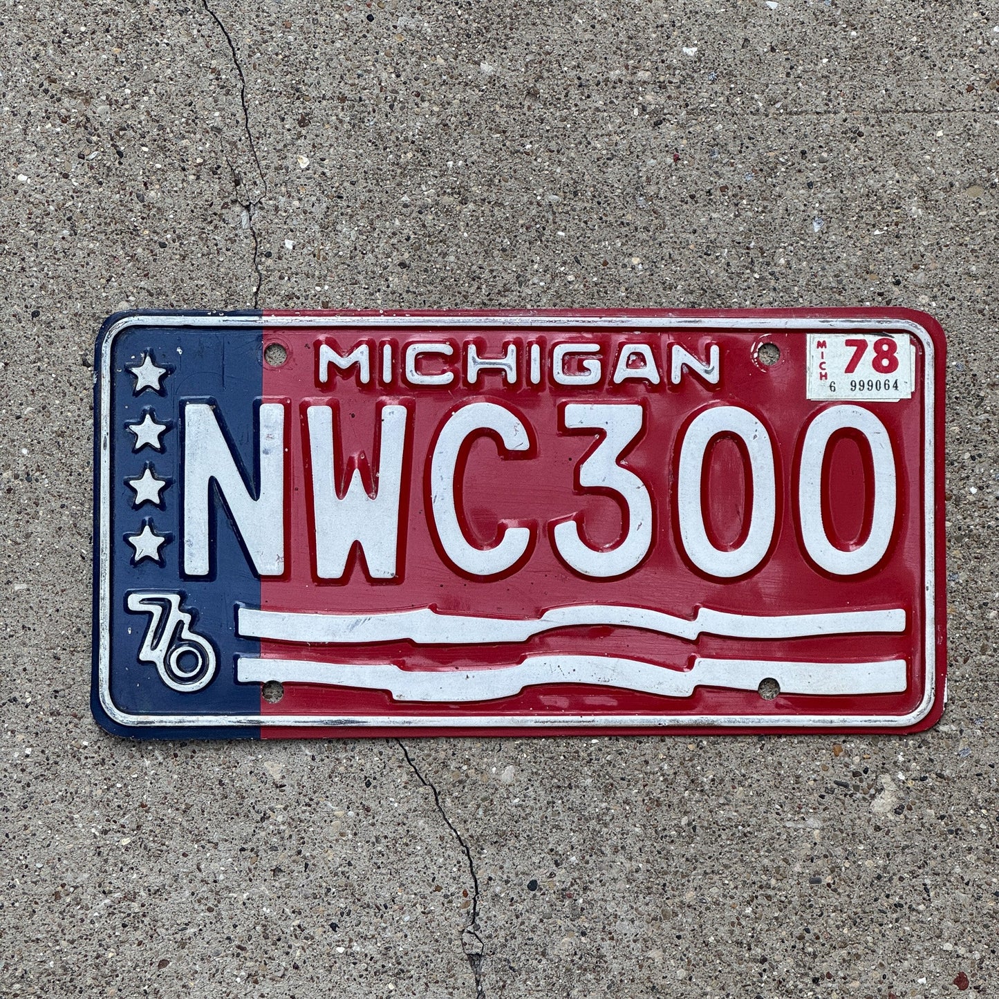 Photo of a 1976 Michigan License Plate Auto Tag Garage Decor Vintage Bicentennial Red White Blue NWC 300