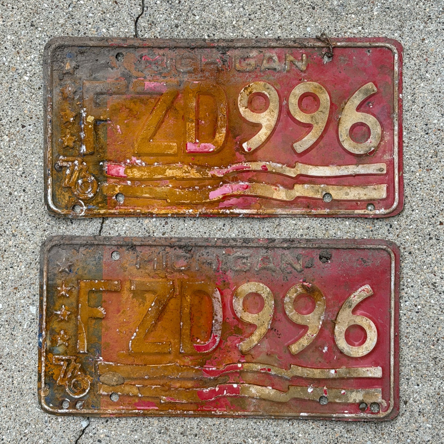Photo of a 1976 Michigan License Plate Pair Auto Tag Garage Decor Vintage Bicentennial FZD 996 with original patina