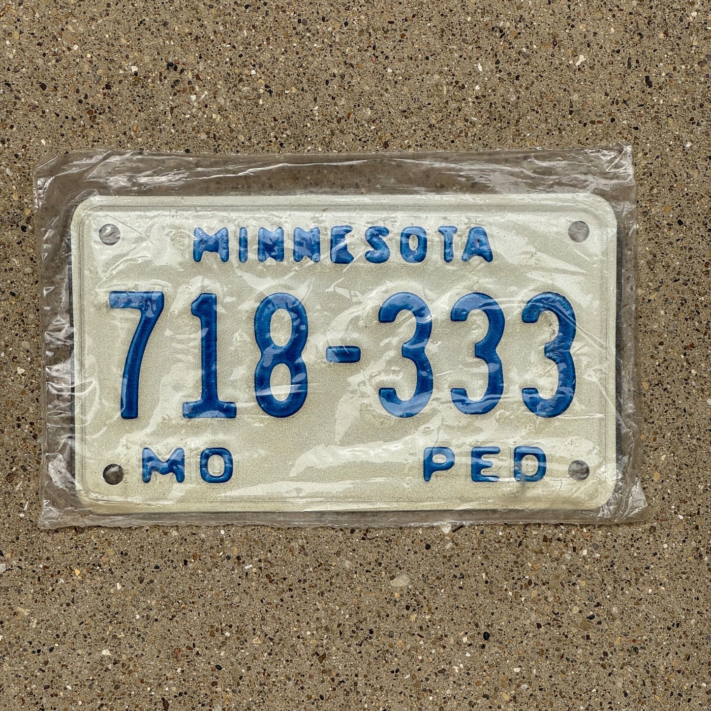 Photo of a 1976 Minnesota Moped License Plate Auto Tag Garage Decor Vintage Repeat Repeating New Old Stock 718 333