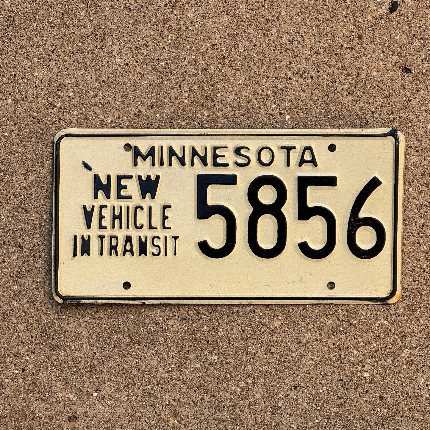 Photo of a 1976 Minnesota New Vehicle In Transit License Plate Auto Tag Garage Decor Vintage 5856