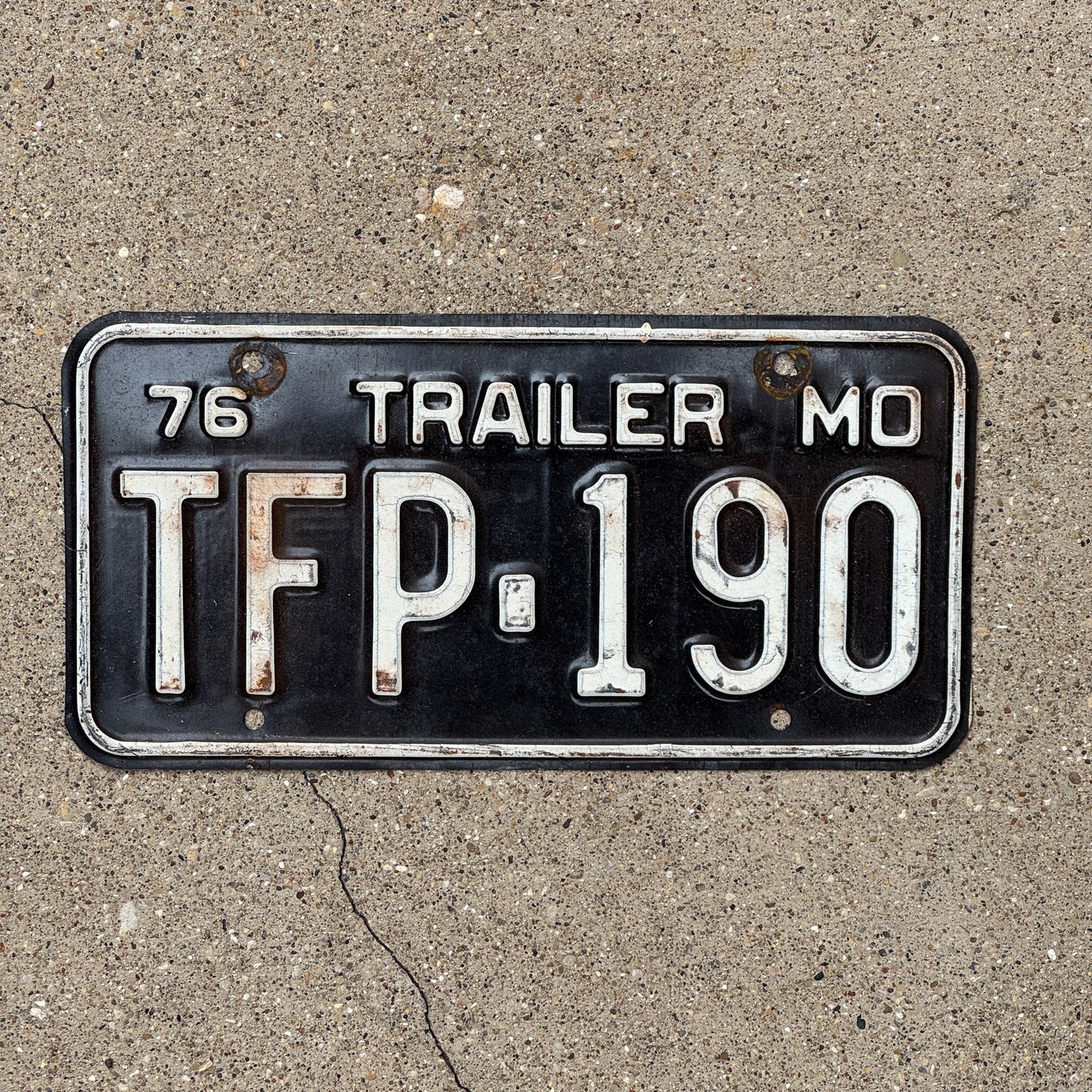 Photo of a 1976 Missouri Trailer License Plate Auto Tag Garage Decor Vintage TFP 190
