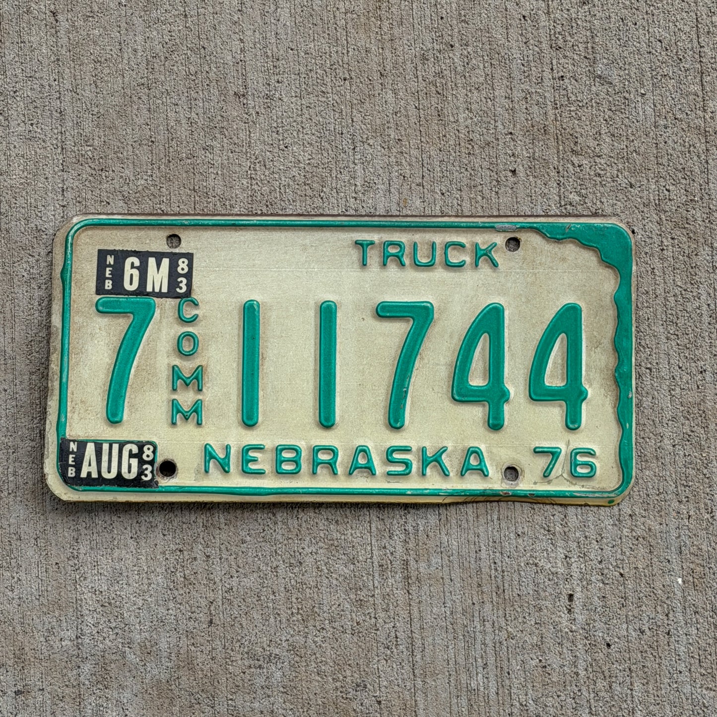 Photo of a 1976 Nebraska Commercial License Plate Auto Tag Garage Decor Vintage 7 11744 with original patina