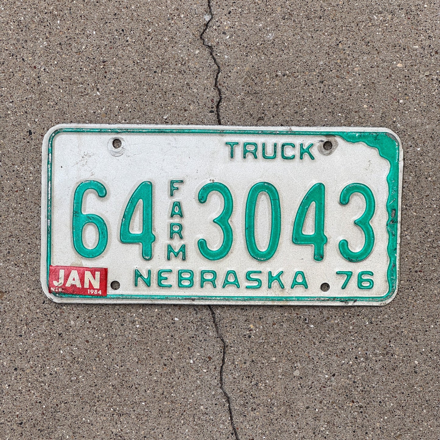 Photo of a 1976 Nebraska Farm Truck License Plate Auto Tag Garage Decor Vintage 64 3043