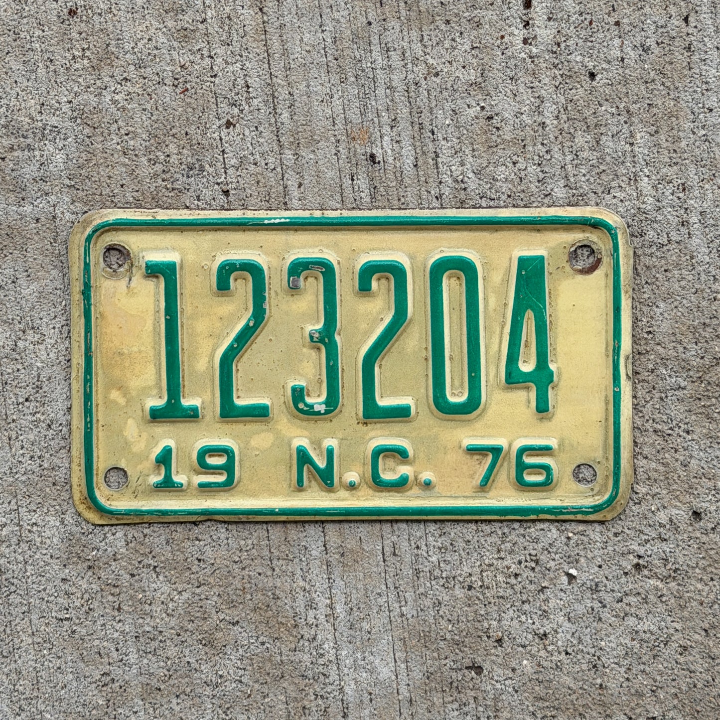 Photo of a 1976 North Carolina Motorcycle License Plate Auto Tag Garage Decor Vintage 123204 with original patina