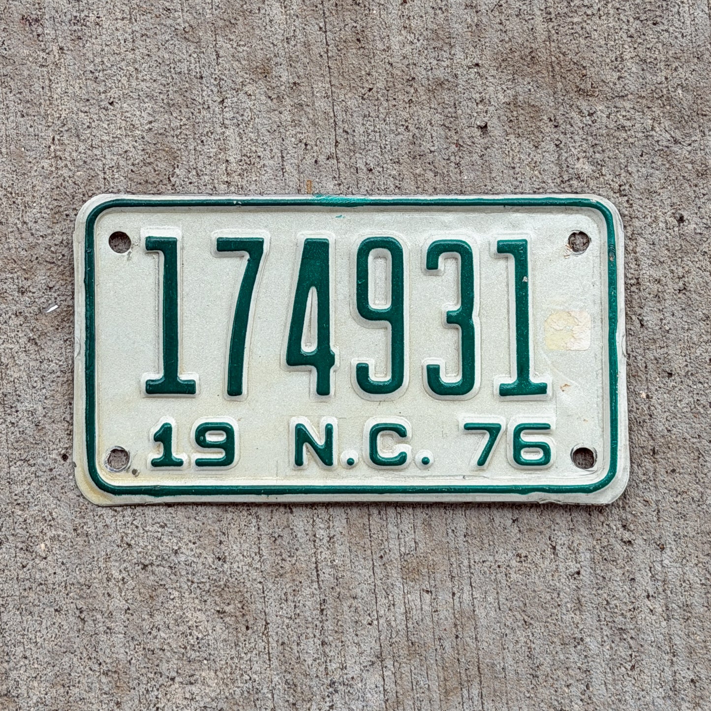 Photo of a 1976 North Carolina Motorcycle License Plate Auto Tag Garage Decor Vintage 174931 with original patina