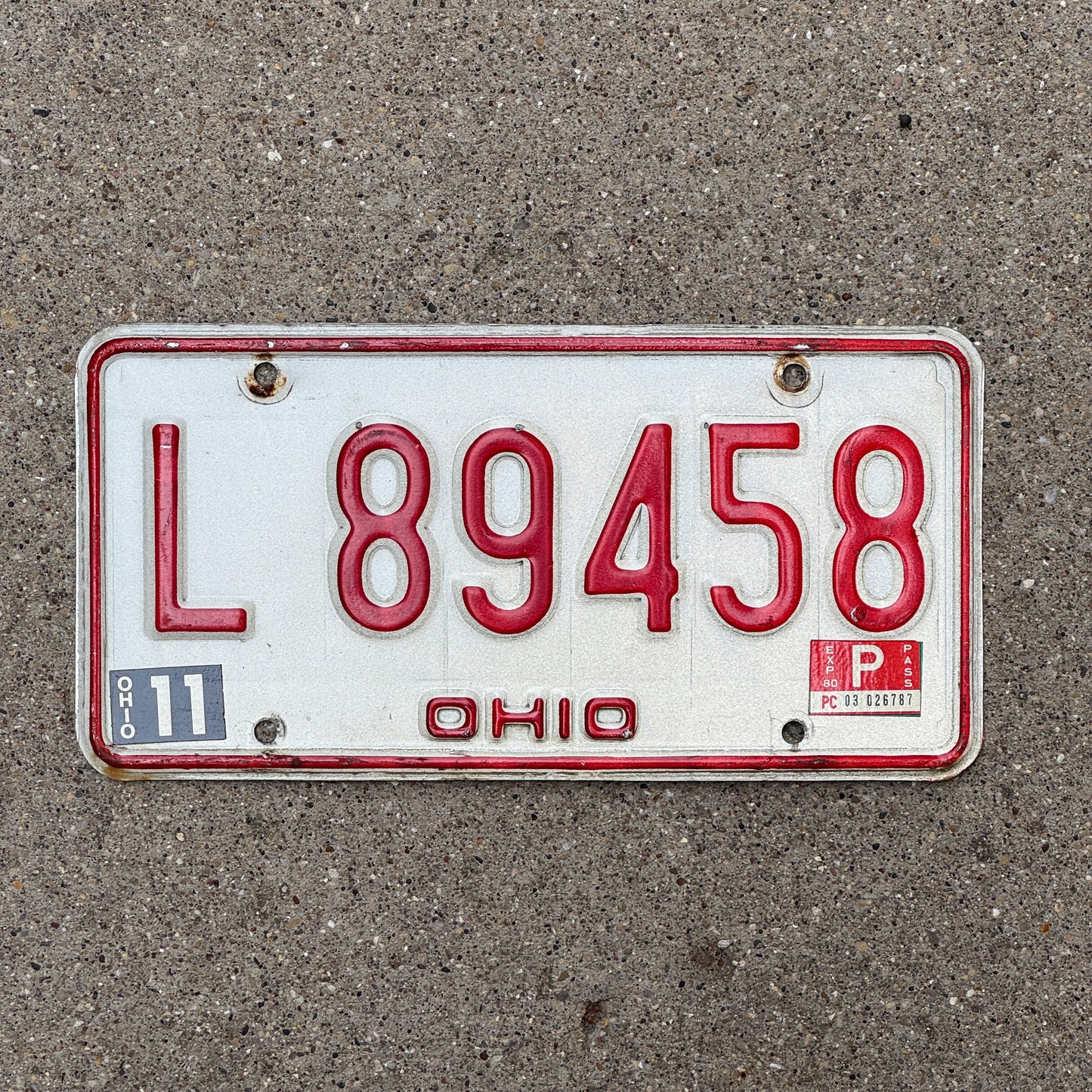 Photo of a 1976 Ohio License Plate Auto Tag 1 Vintage Garage L 89458 with original patina