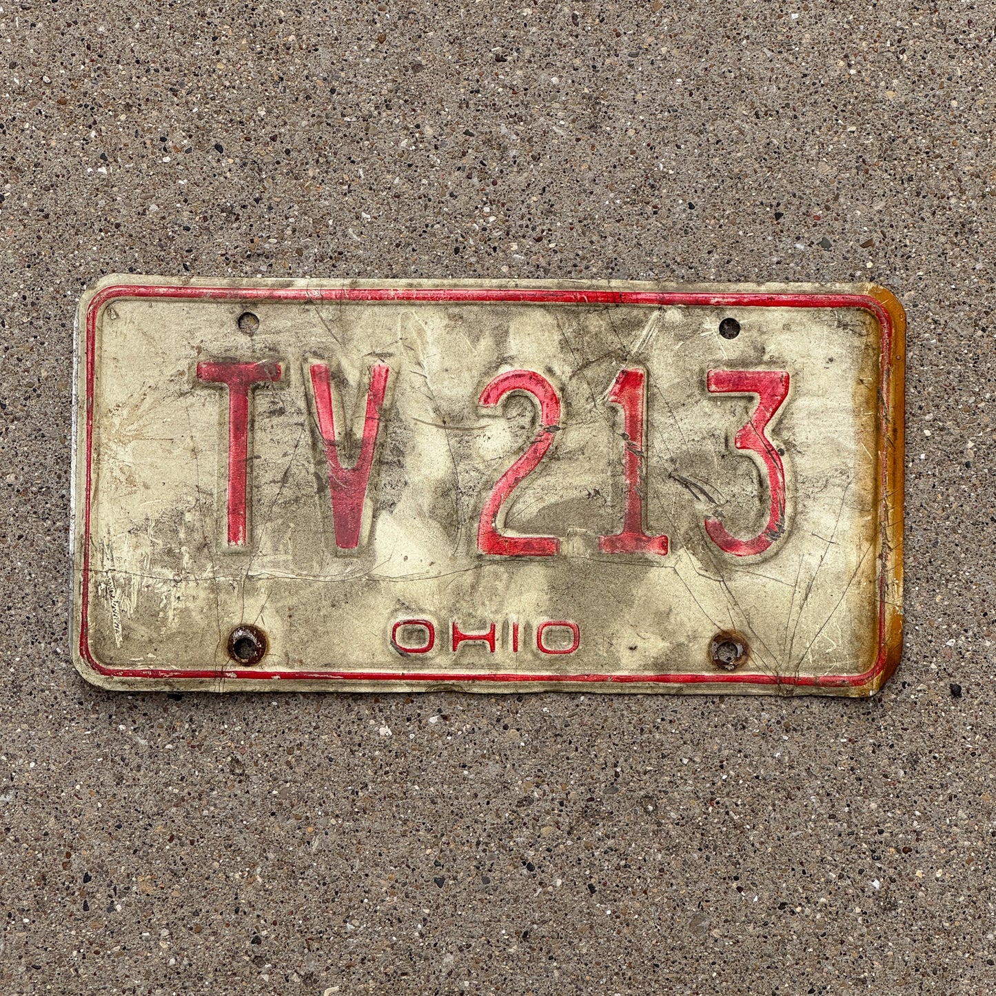 Photo of a 1976 Ohio License Plate Auto Tag 1 Vintage Garage TV 213 with original patina