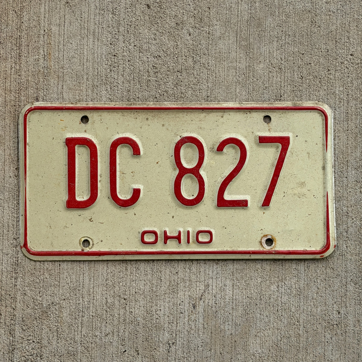 Photo of a 1976 Ohio License Plate Auto Tag Garage Decor Vintage DC 827 with original patina