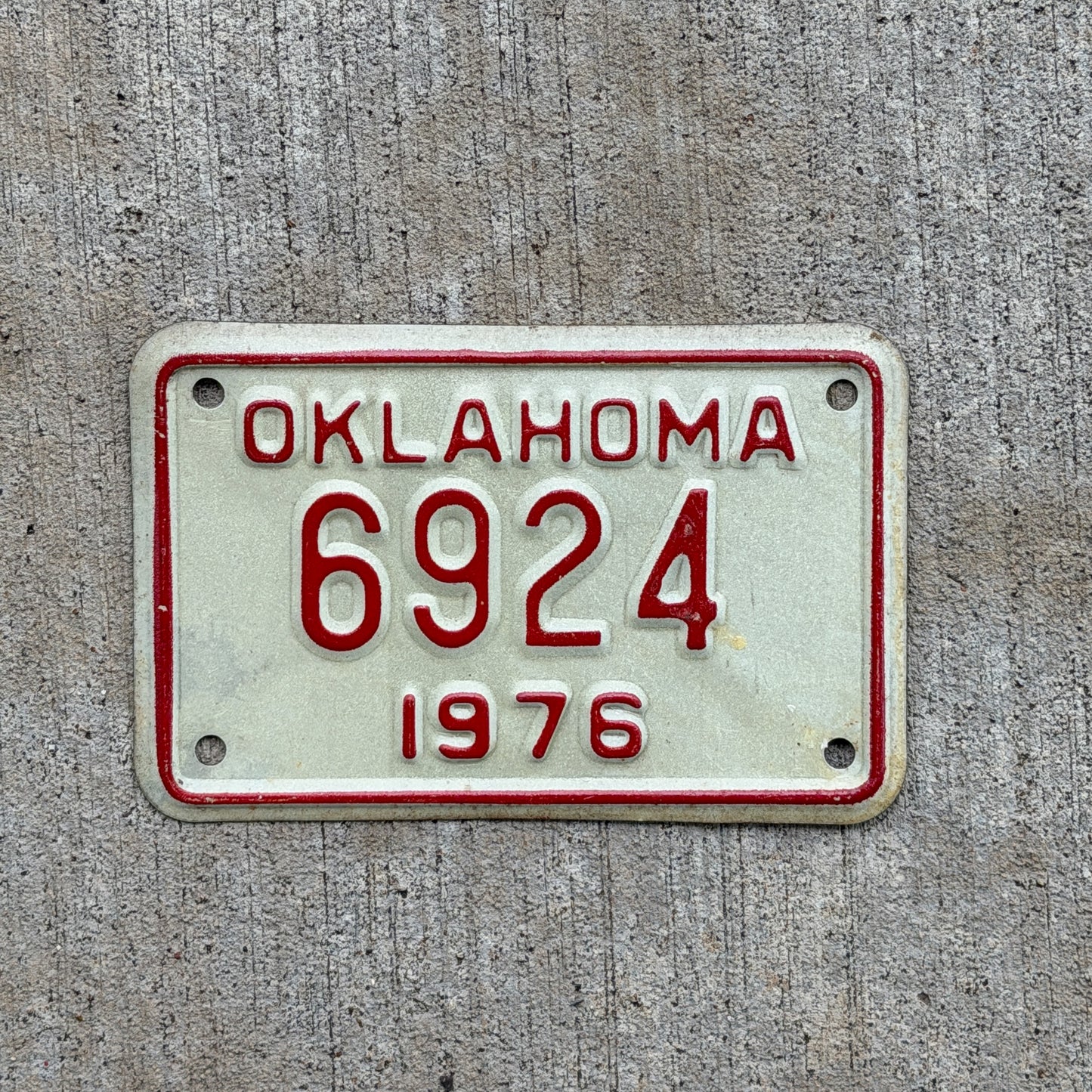 Photo of a 1976 Oklahoma Motorcycle License Plate Auto Tag Garage Decor Vintage 6924 with original patina