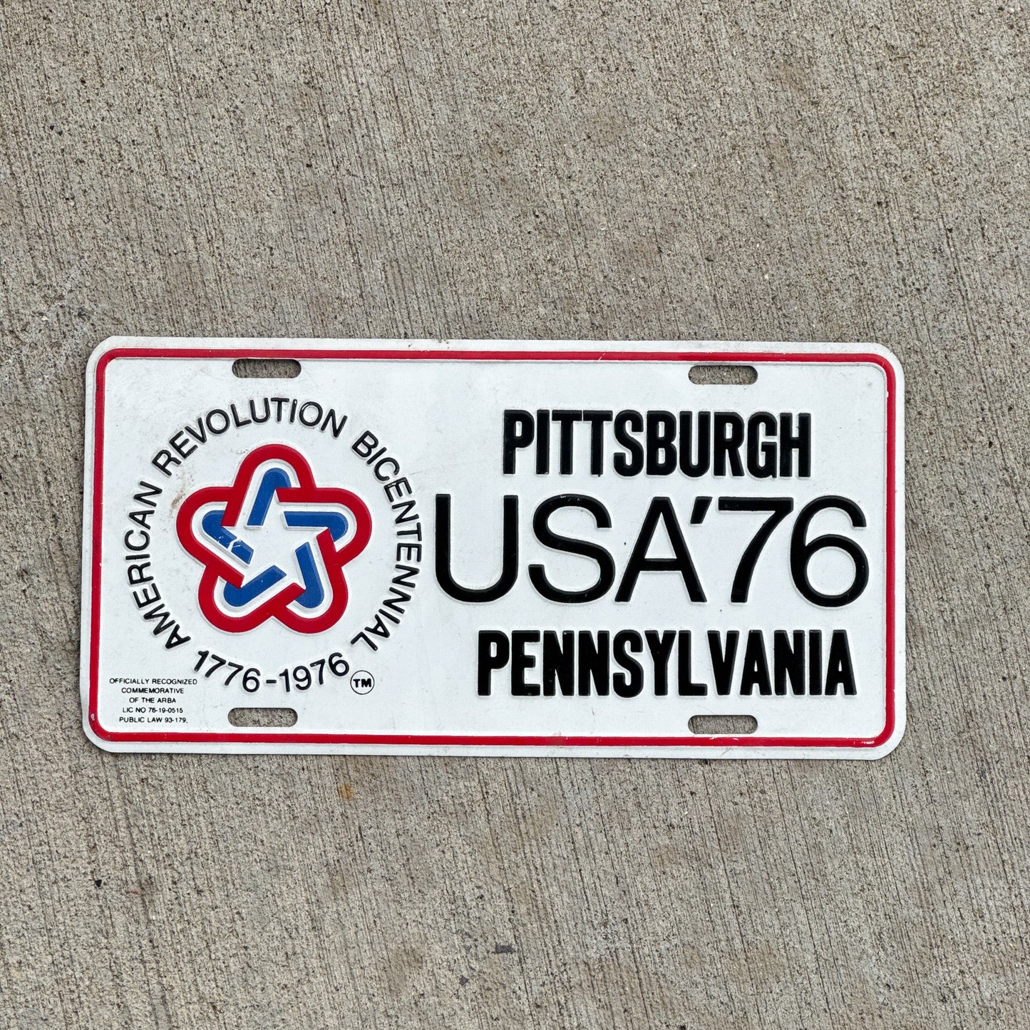 Photo of a 1976 Pennsylvania Booster License Plate Auto Tag Garage Decor Vintage American Revolution Bicentennial Pittsburgh USA '76 with original patina