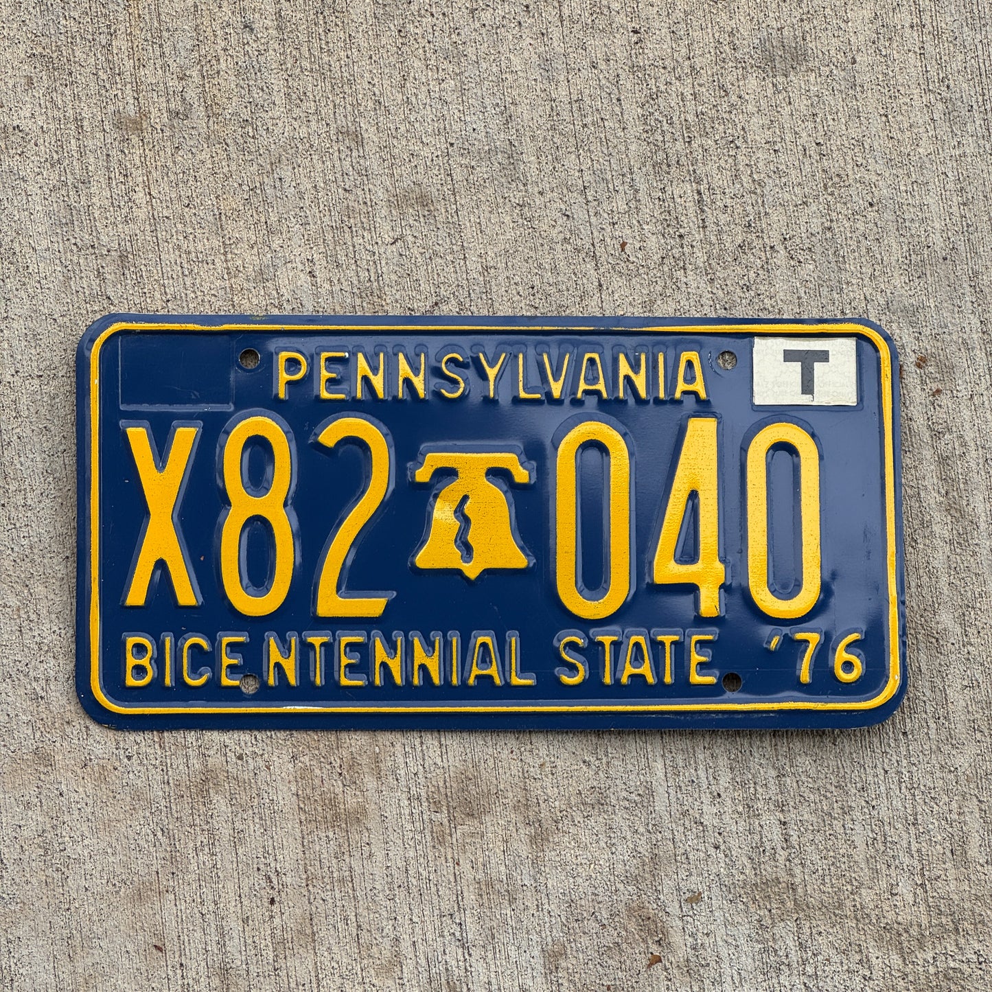 Photo of a 1976 Pennsylvania License Plate Auto Tag Garage Decor Vintage T Sticker Bicentennial X82 040 with original patina