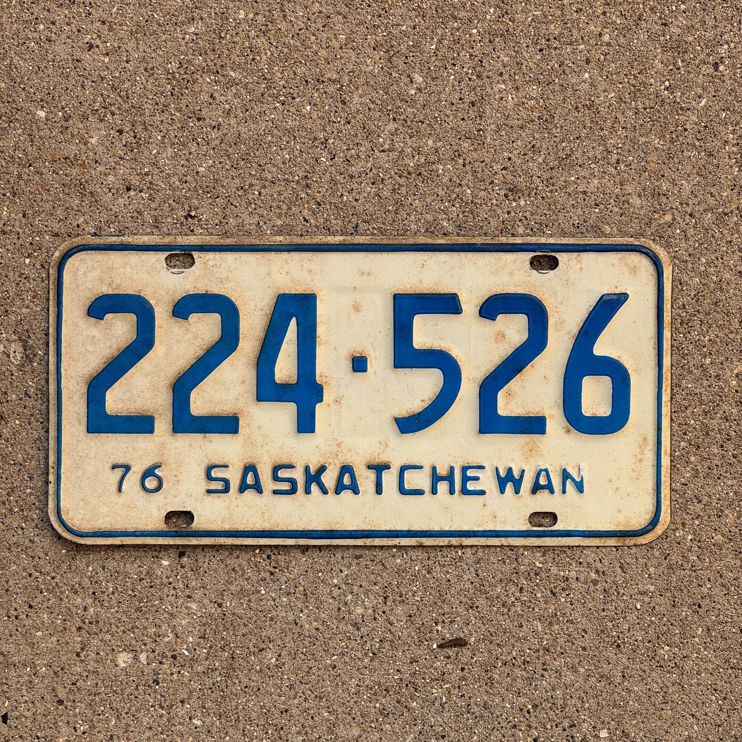 Photo of a 1976 Saskatchewan License Plate Auto Tag Garage Decor Vintage 224 526