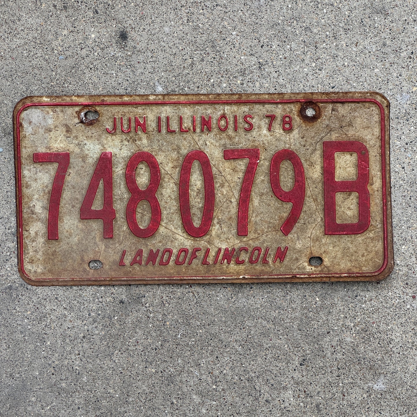 Photo of a 1977 1978 Illinois Truck License Plate Auto Tag Garage Decor Vintage 748 079 B with original patina