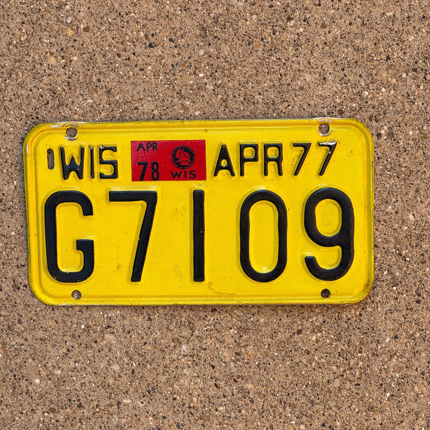Photo of a 1977 1978 Wisconsin Motorcycle License Plate Auto Tag Garage Decor Vintage G 7109