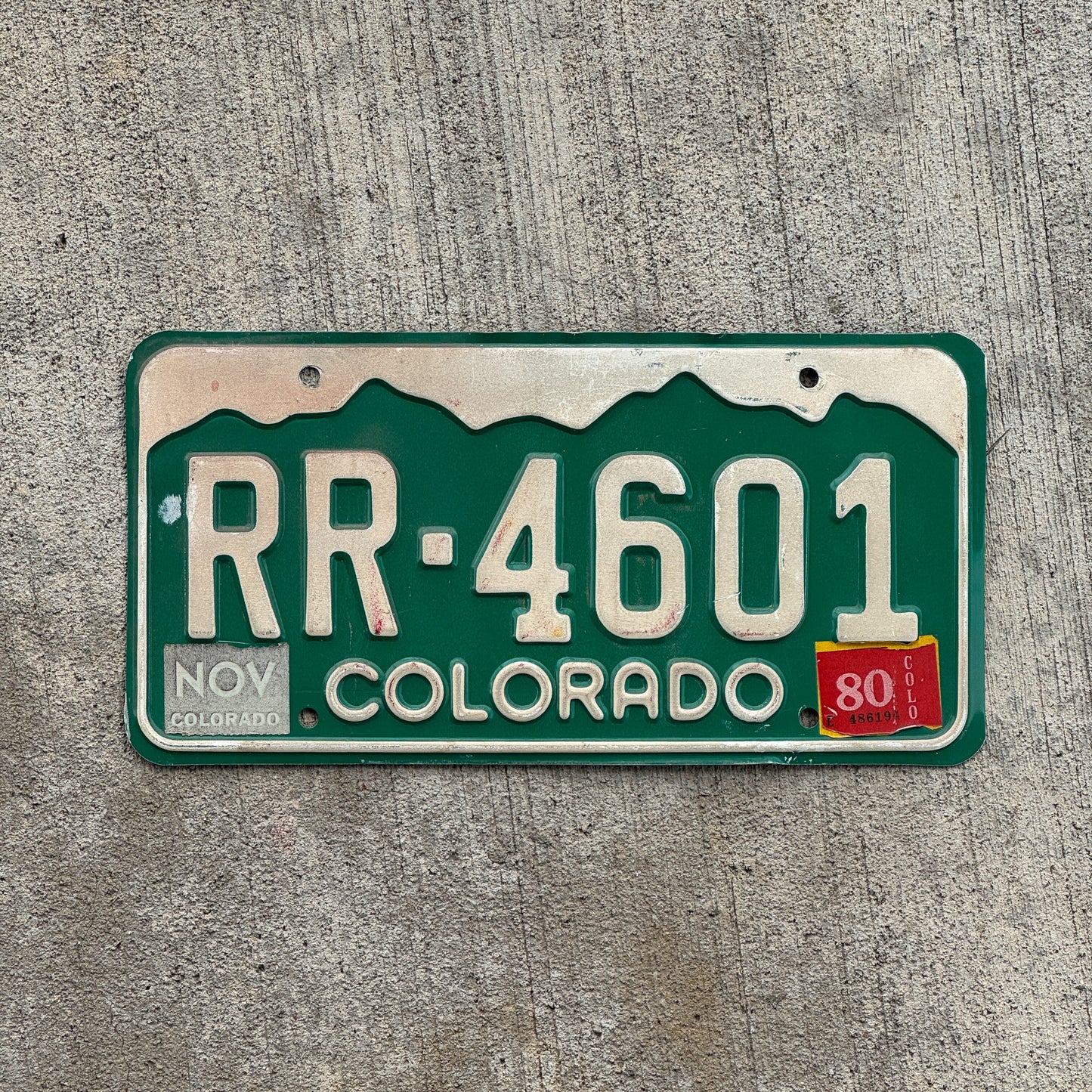Photo of a 1977 1980 Colorado License Plate Auto Tag Garage Decor Vintage RR 4601 with original patina