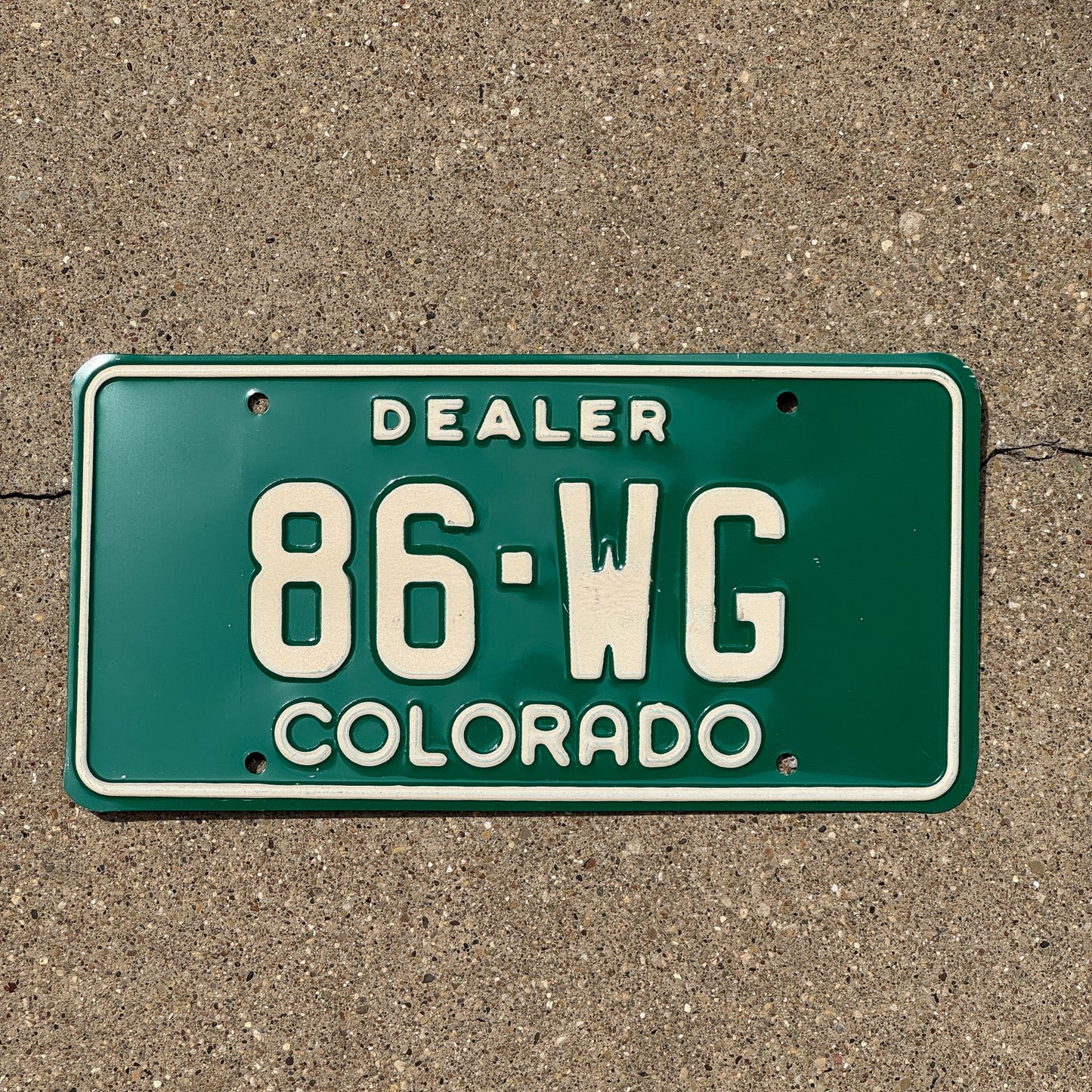 Photo of a 1977 Colorado Dealer License Plate Auto Tag 2 Garage Decor 89 WG