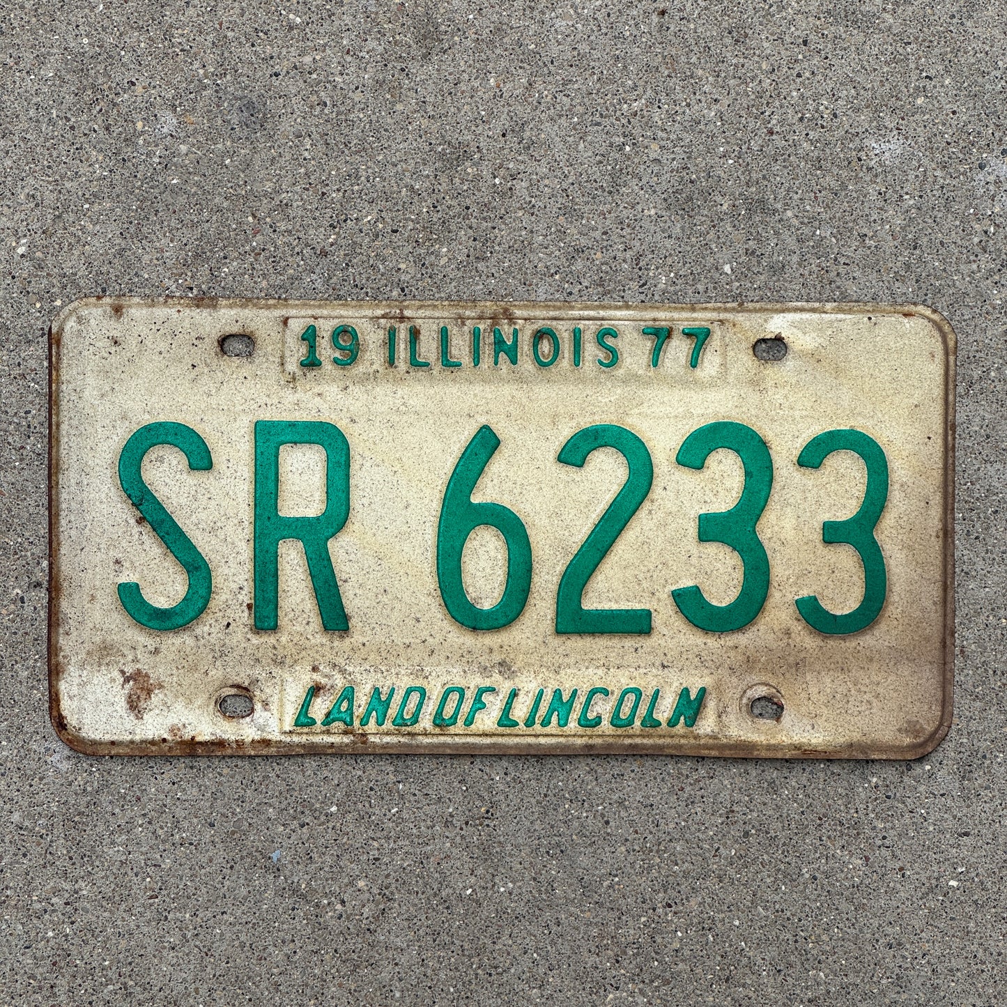 Photo of a 1977 Illinois License Plate Auto Tag 1 Vintage Garage SR 6233 with original patina