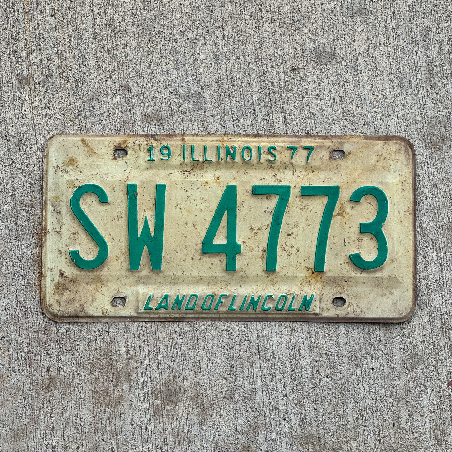 Photo of a 1977 Illinois License Plate Auto Tag 1 Vintage Garage SW 4773 with original patina