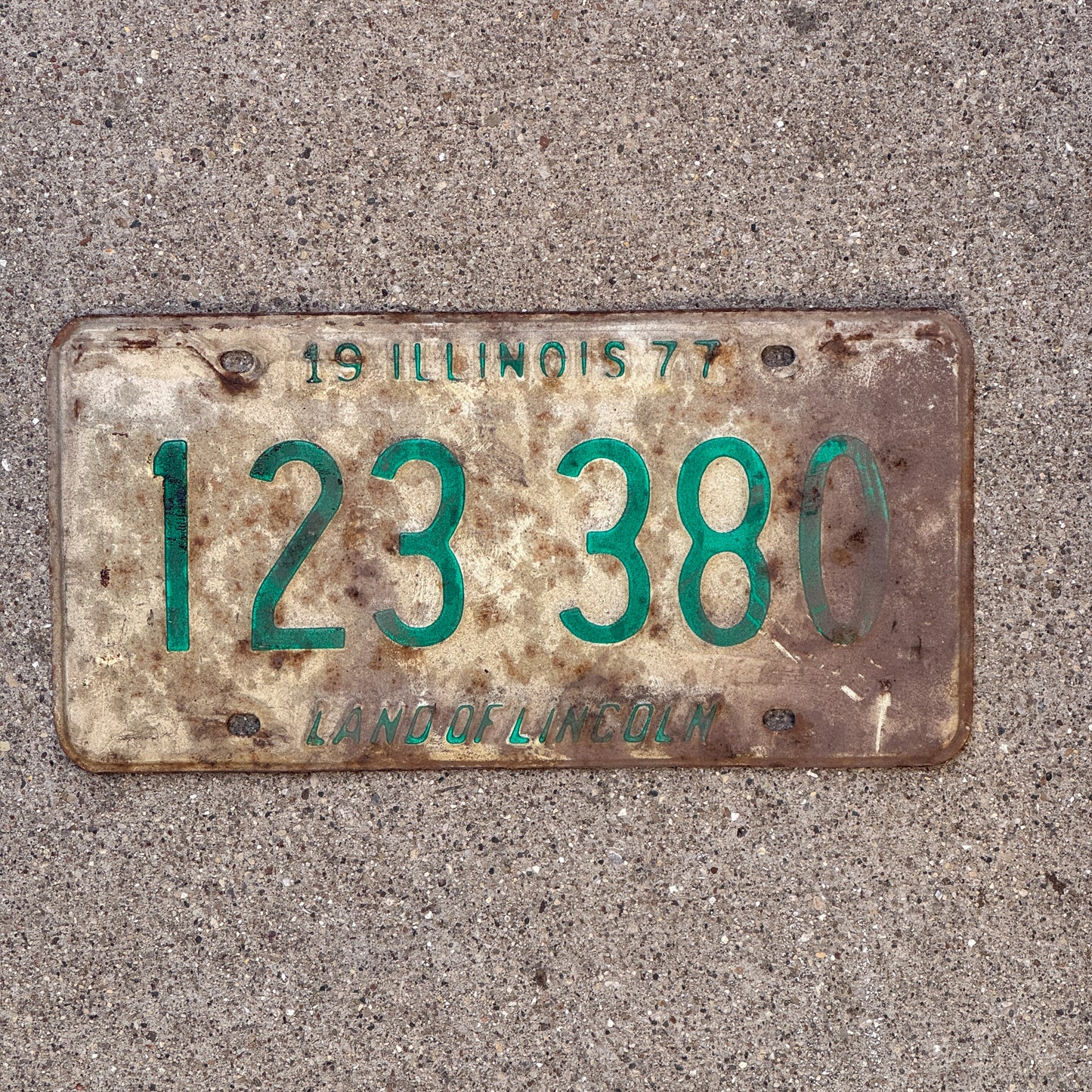 Photo of a 1977 Illinois License Plate Auto Tag Garage Decor Vintage 123 380 with original patina