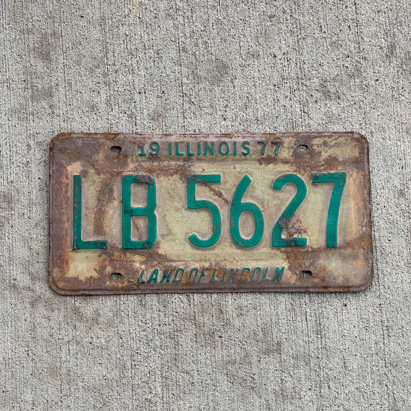 Photo of a 1977 Illinois License Plate Auto Tag Garage Decor Vintage LB 5627 with original patina
