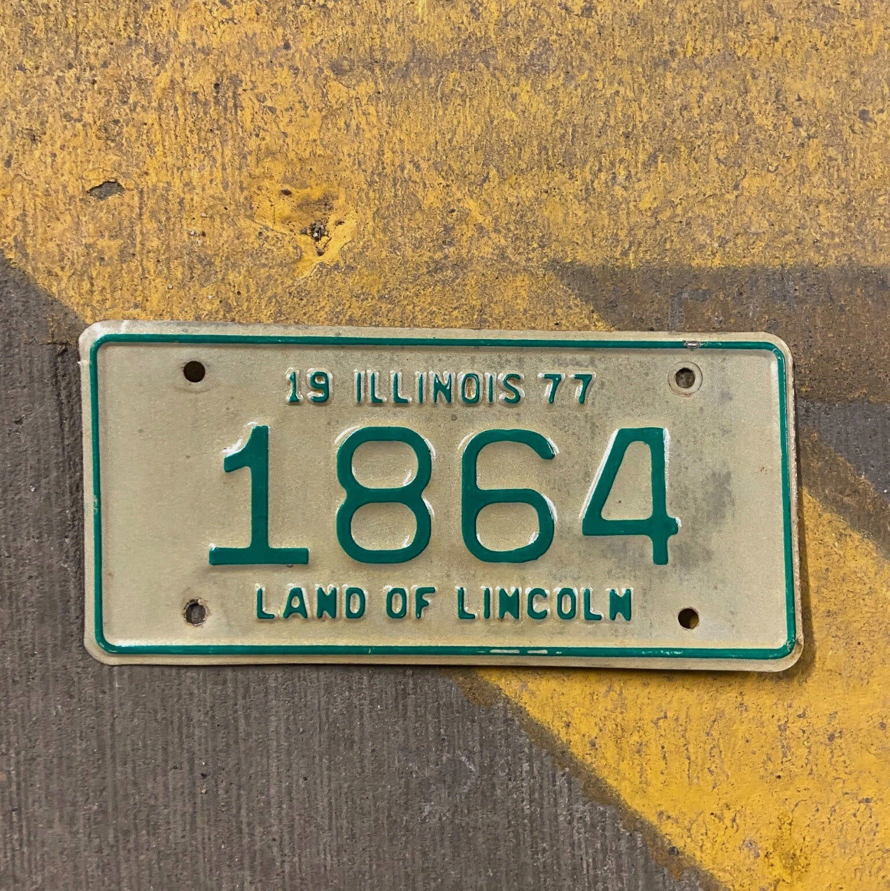 Photo of a 1977 Illinois Motorcycle License Plate Auto Tag Garage Decor Vintage Low Number Four Digit 420 Weed 1864 with original patina