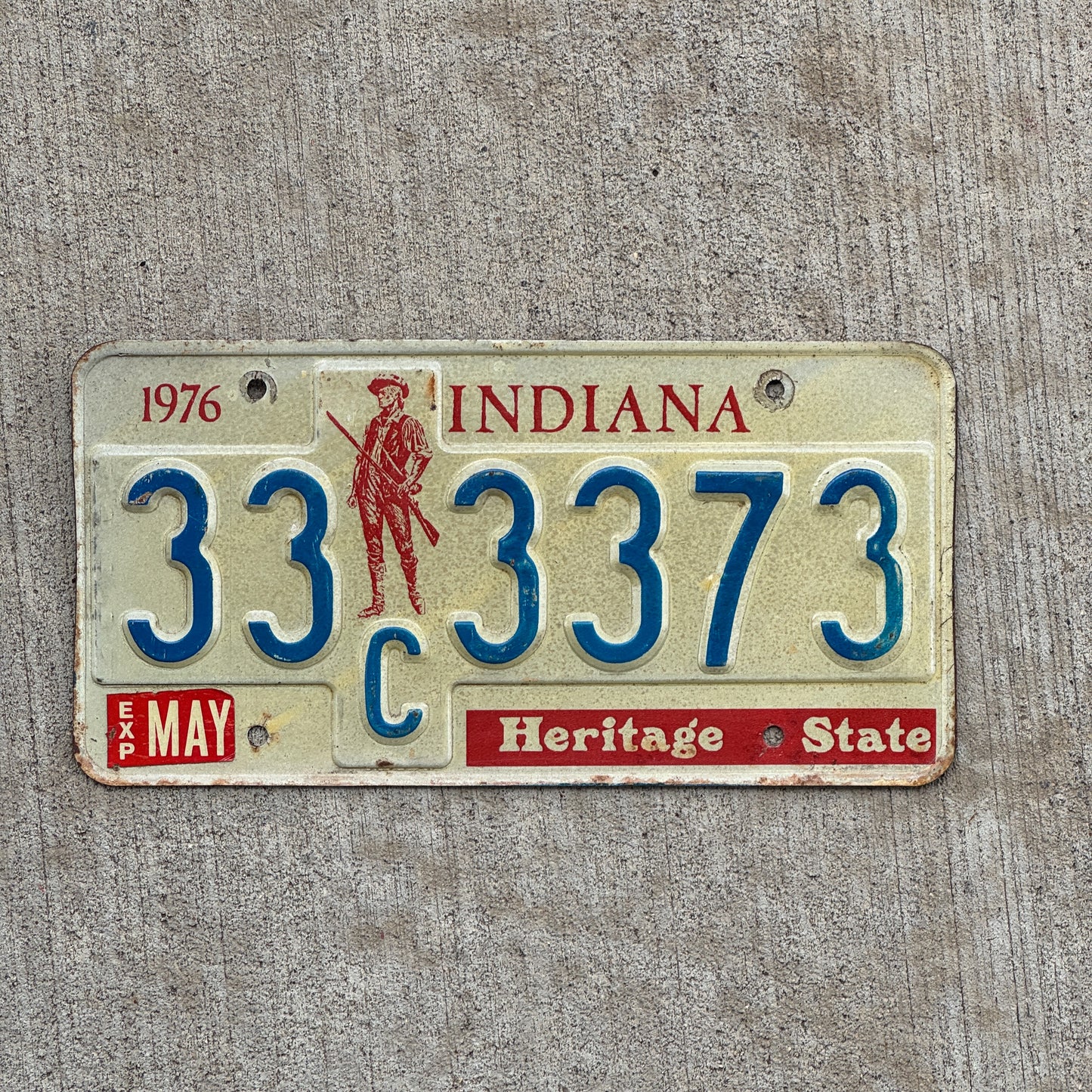 Photo of a 1977 Indiana License Plate Auto Tag Garage Decor Vintage 33 C 3373 with original patina