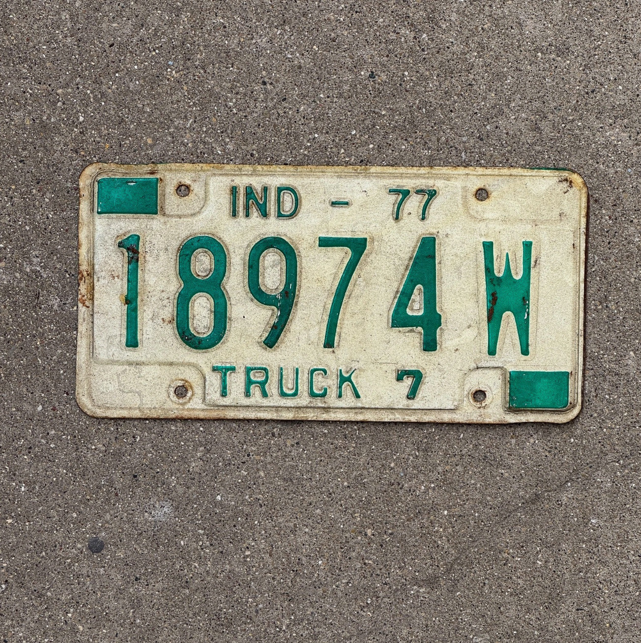 Photo of a 1977 Indiana Truck License Plate Auto Tag Garage Decor 18974 W