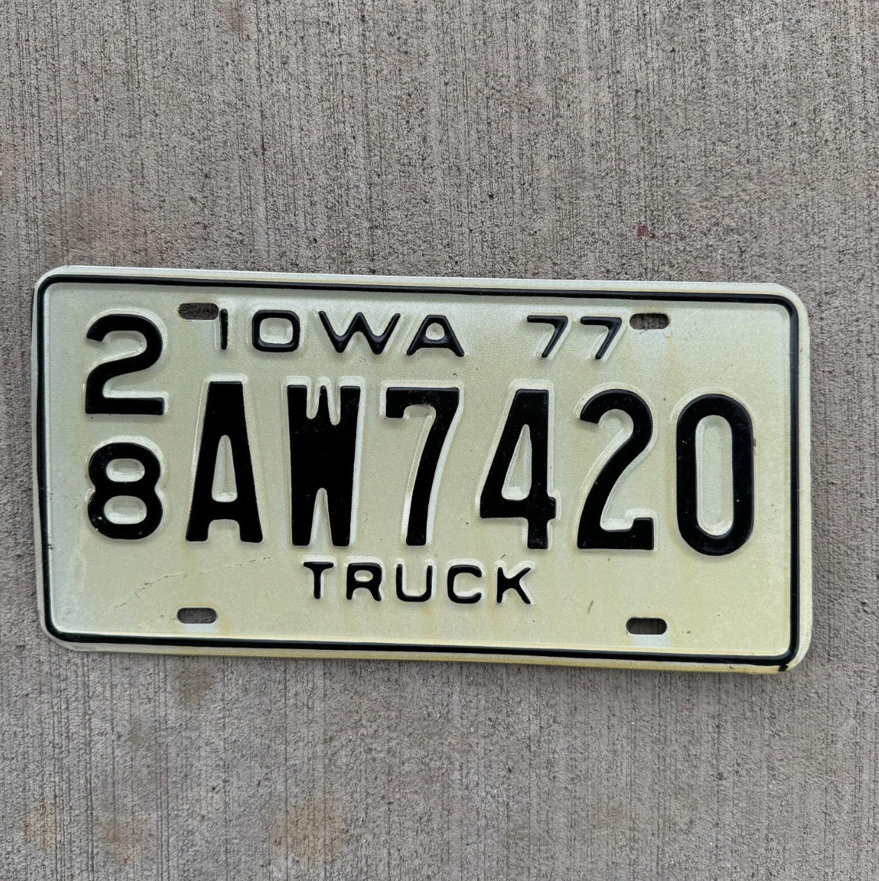 Photo of a 1977 Iowa Truck License Plate Auto Tag 1 Garage Decor Weed Smoke AW 7420