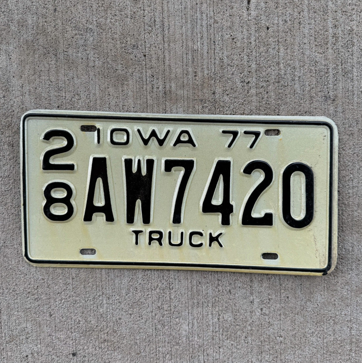 Photo of a 1977 Iowa Truck License Plate Auto Tag 2 Garage Decor Weed Smoke AW 7420