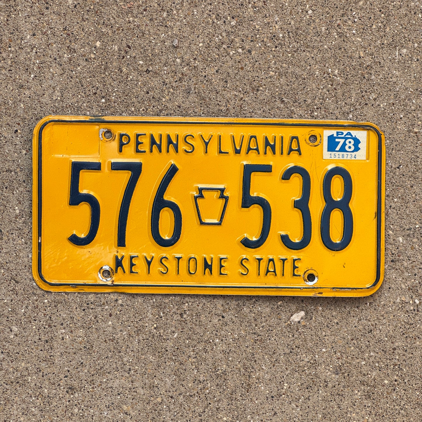 Photo of a 1977 Pennsylvania license plate with a 1978 registration sticker.