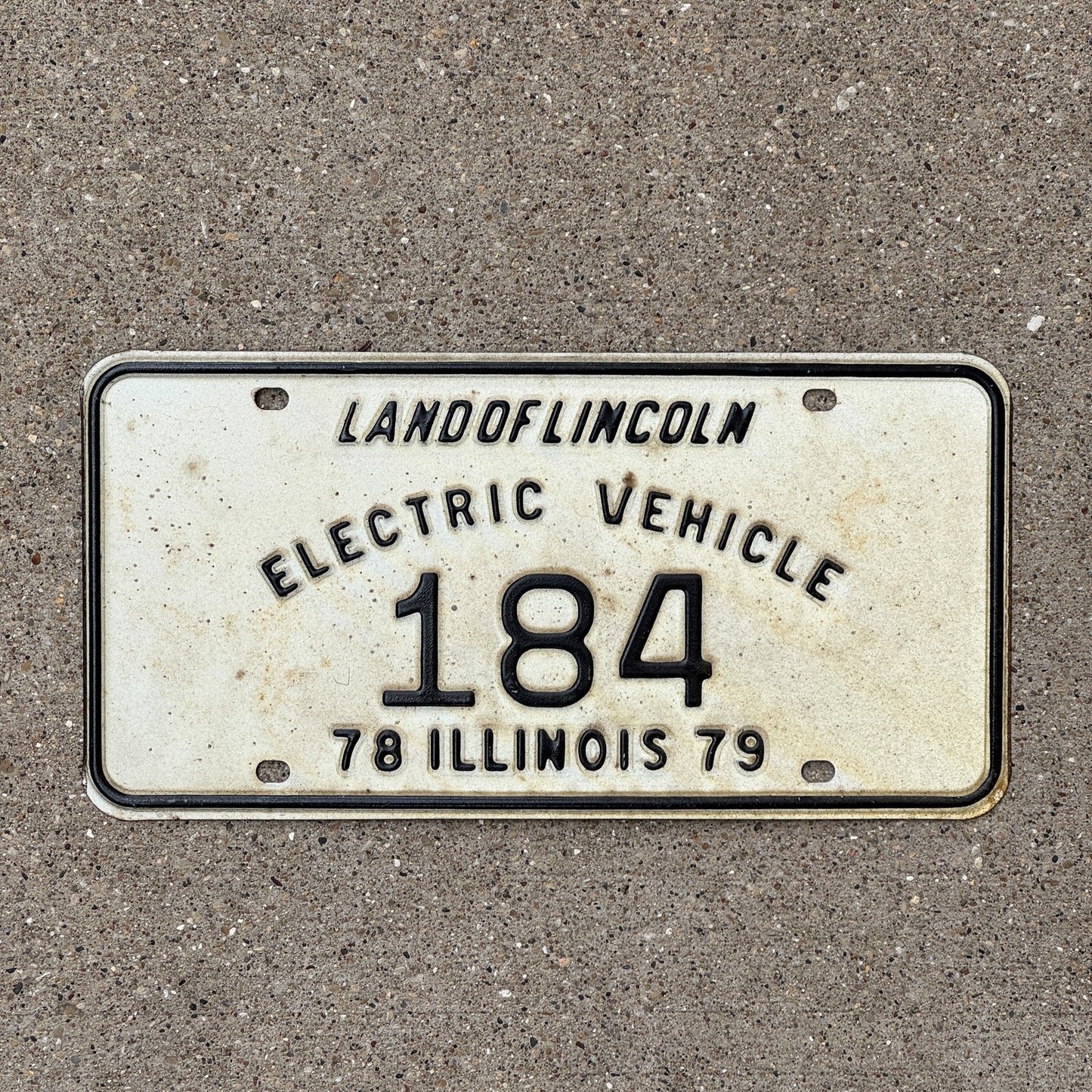Photo of a 1978 1979 Illinois Electric Vehicle License Plate Auto Tag Garage Decor Vintage 184