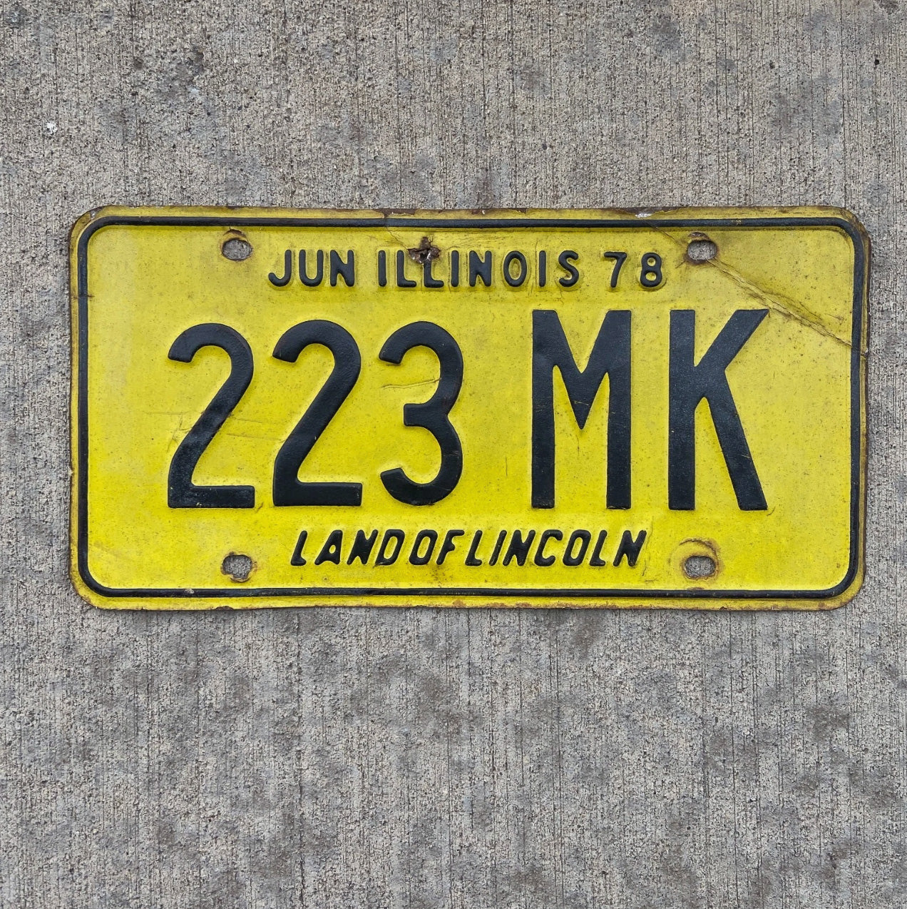 Photo of a 1978 Illinois Truck Mileage Tax License Plate Auto Tag Garage Decor Vintage 223 MK with original patina