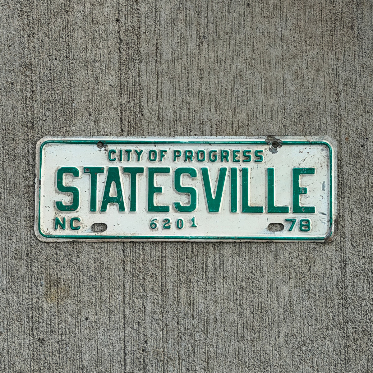 Photo of a 1978 Statesville North Carolina License Plate Topper Auto Tag Garage Decor Vintage
City of Progress 6201 with original patina
