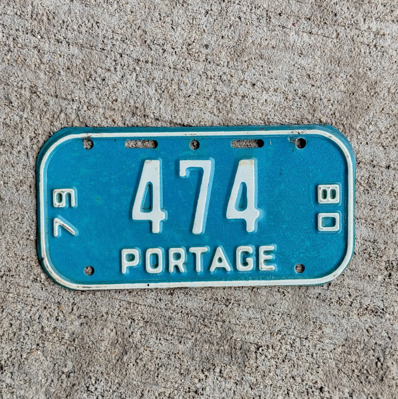 Photo of a 1979 1980 Wisconsin Bicycle License Plate Auto Tag Garage Decor Vintage Portage Bike Small Size Oddball Blue 474