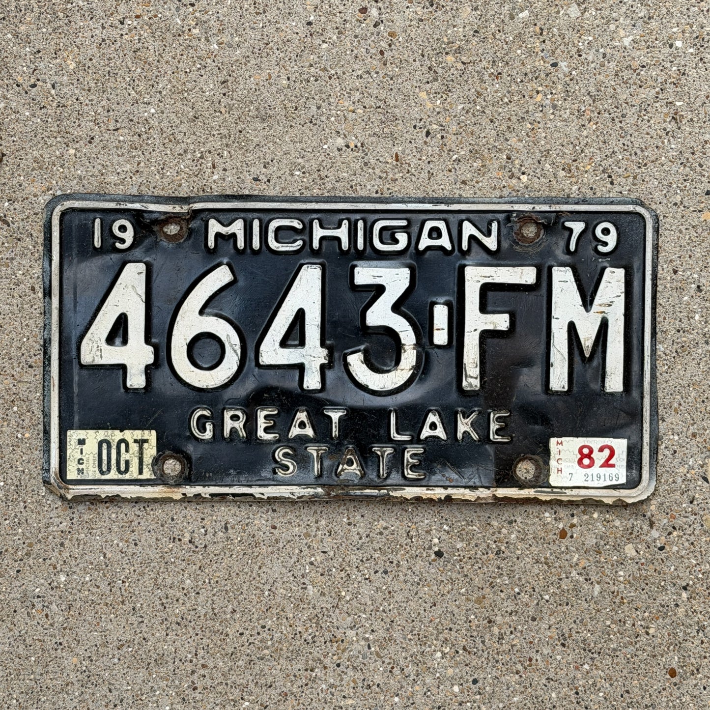 Photo of a 1979 1982 Michigan Commercial License Plate Auto Tag Garage Decor Vintage 4643 FM with original patina