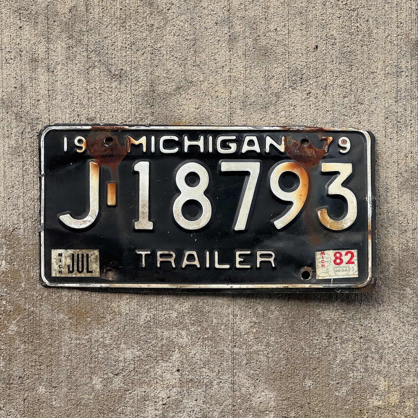 Photo of a 1979 1982 Michigan Trailer License Plate Auto Tag Garage Decor Vintage J 18793 with original patina
