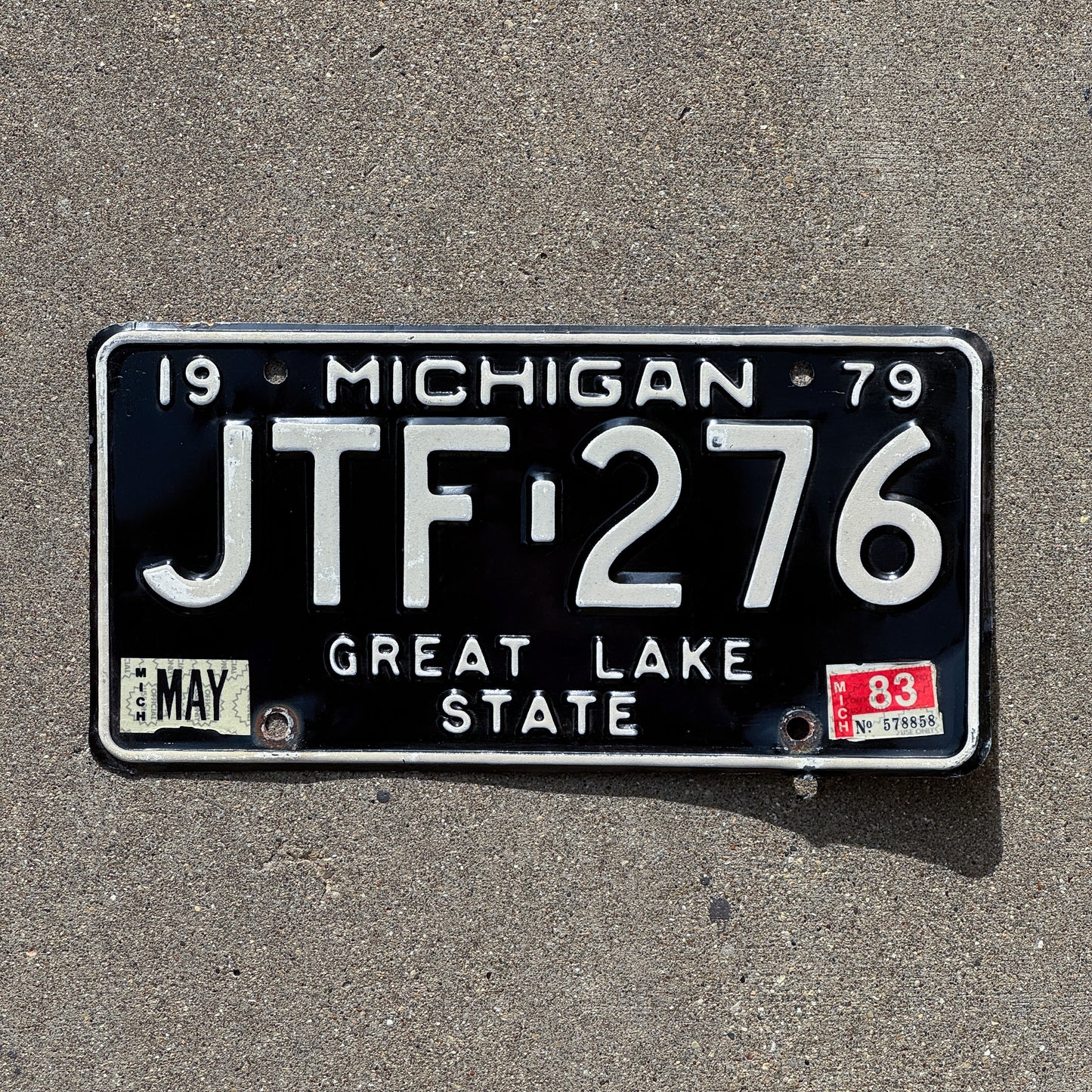 Photo of a 1979 1983 Michigan License Plate Auto Tag Garage Decor Vintage JTF 276 with original patina